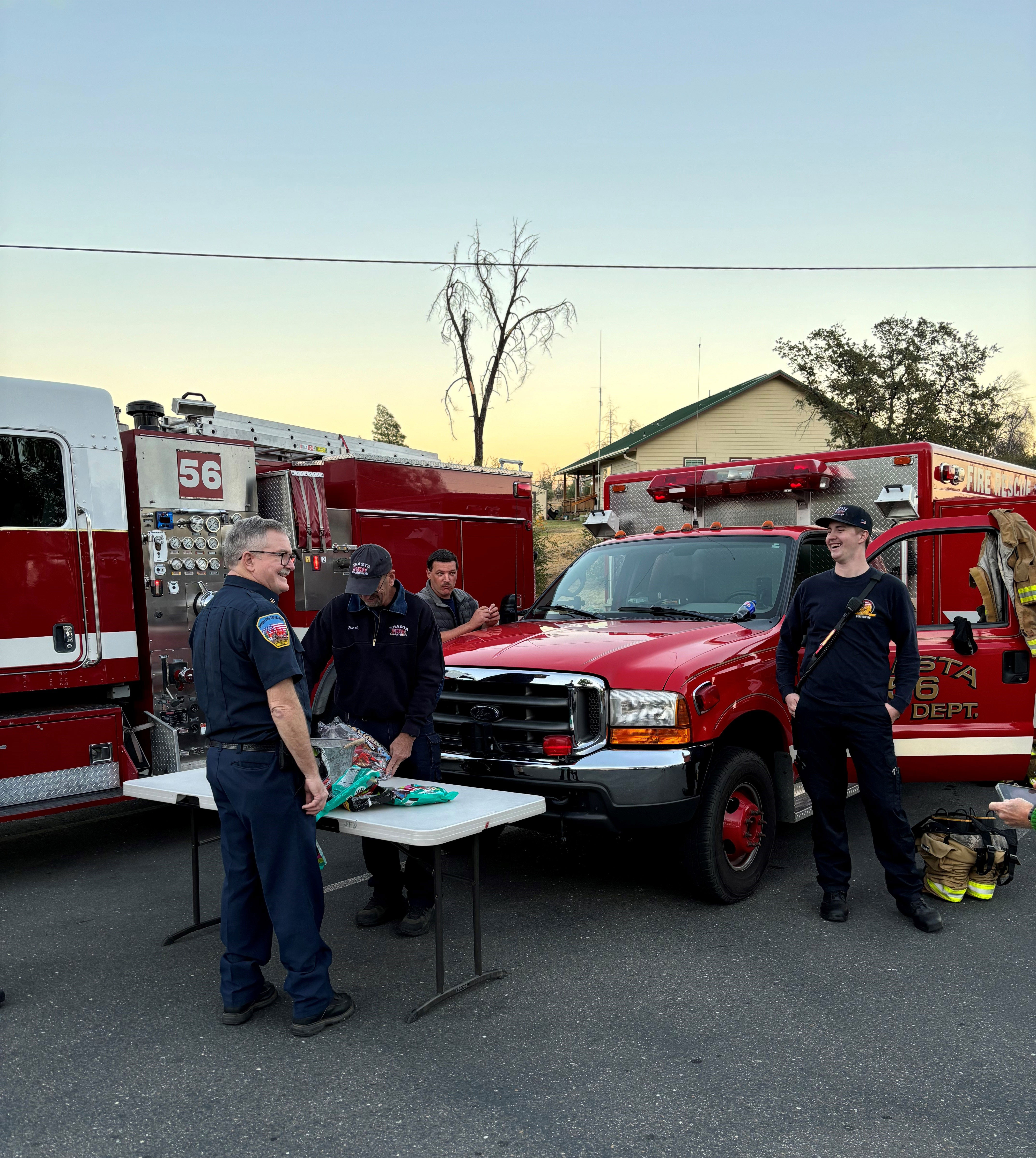 Firefighters with equipment and vehicles